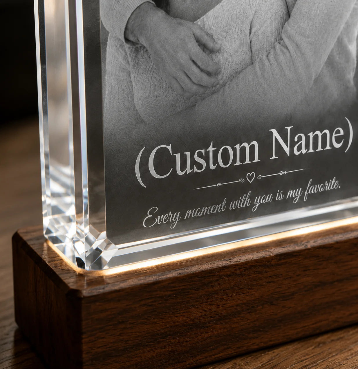 Custom engraved glass block with a photo and text on wooden base
