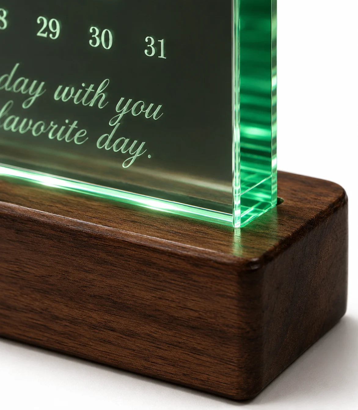 A wooden base supports a glowing glass plaque with a heartfelt message