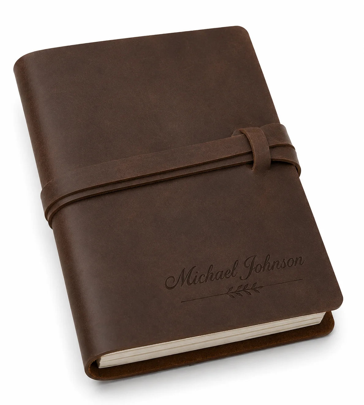 Brown leather-bound journal with embossed name and tied strap on cover
