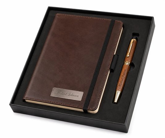 Elegant brown leather notebook and gold pen set in a sleek black gift